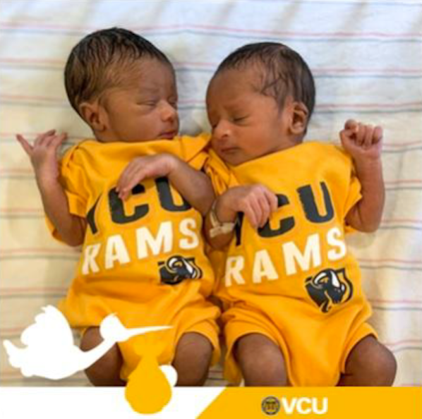 New born twind wearing matching VCU Rams onzies